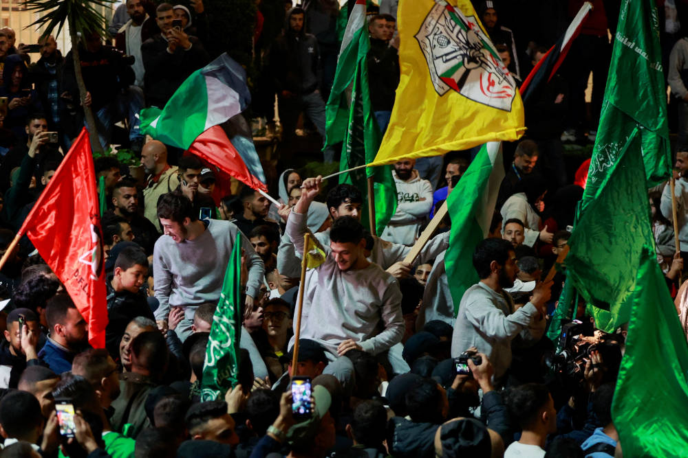 Released Palestinian prisoners leave the Israeli military prison near Ramallah